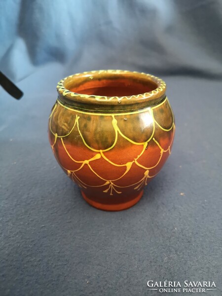 Glazed ceramic vessel decorated with old folk motifs