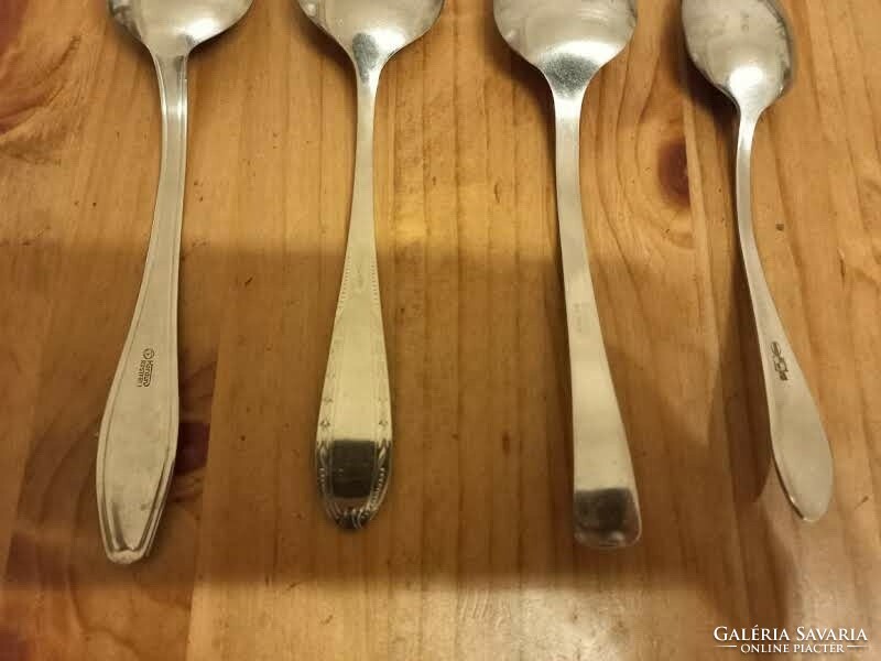 4 different stainless steel spoons