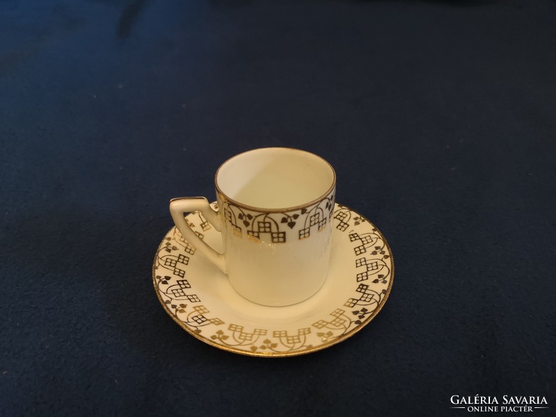 Gold-decorated porcelain mocha cup + saucer