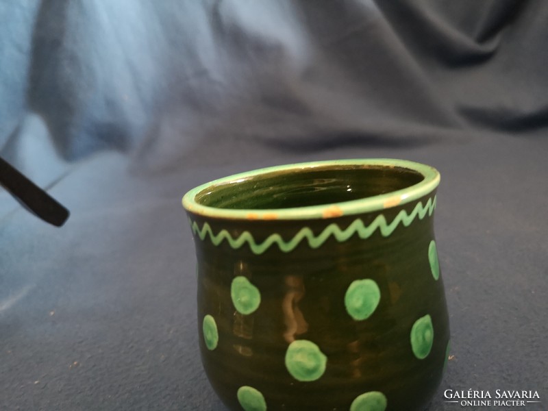 Glazed ceramic mug decorated with old folk motifs
