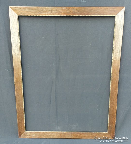 Elegant, large, thin wooden frame with small blondel decorations. 69.5X89.5