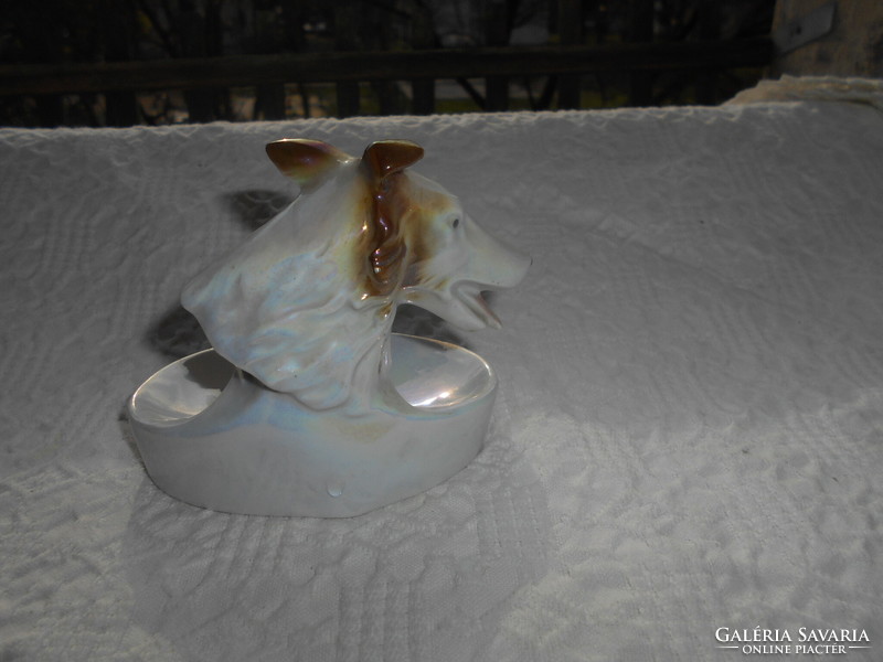 Art deco style porcelain ashtray with a dog figure on the side
