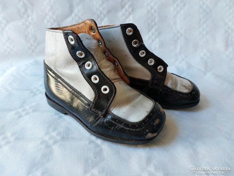 Old children's shoes black and white vintage decoration