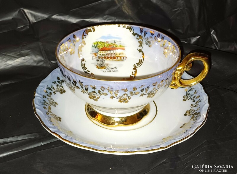 Gilded tea cup with bottom.