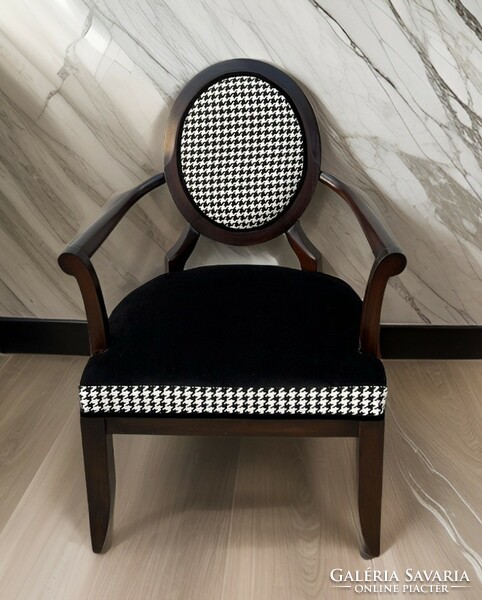 Design armchair with houndstooth pattern upholstery