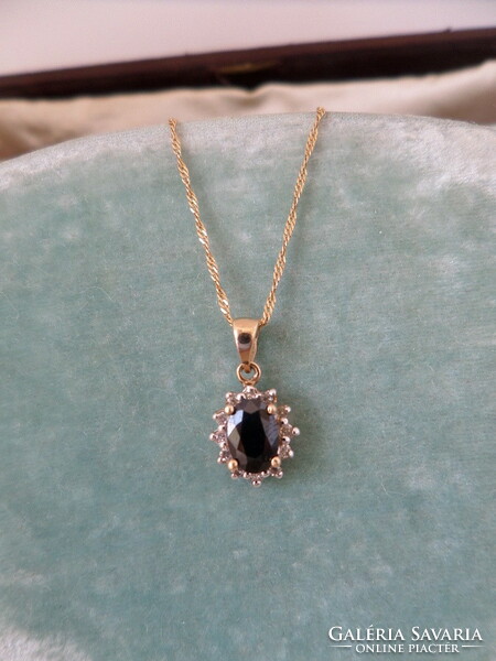 Gold pendant with blue sapphire and brils 9k