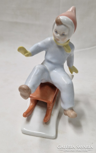 Aquincum porcelain sledding boy figure in perfect condition 11 cm.