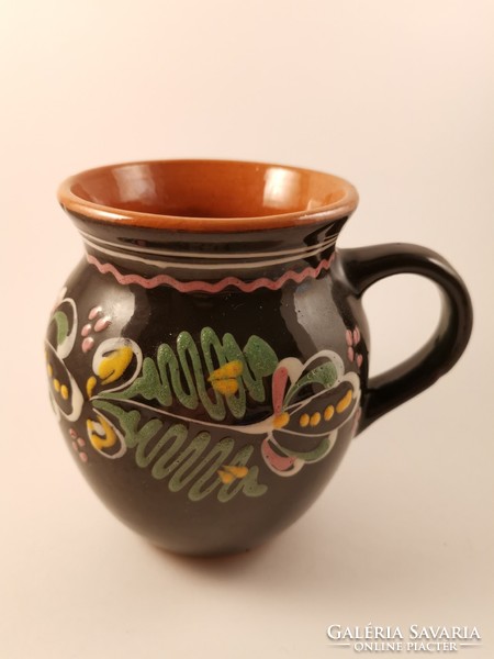 Black ceramic bowl with flower pattern