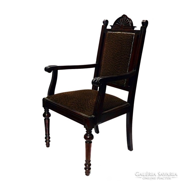 A pewter carved armchair