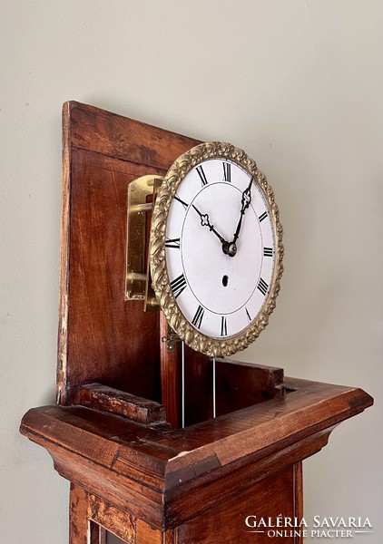 A heavy wall clock in Flemish style