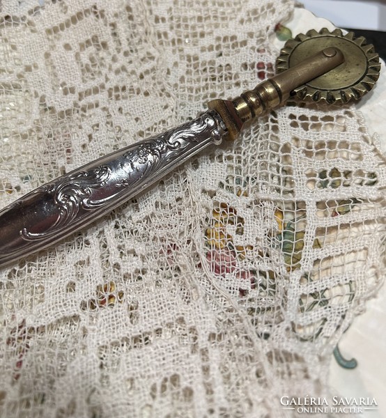 Antique silver, copper-headed brass cutter