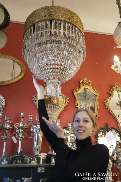 Crystal chandelier in the shape of a half bulb with an openwork frame