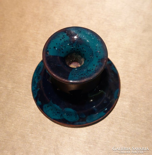 Bluish green candle holder for a thin candle