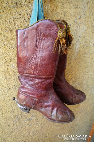 Antique children's leather boots with leather soles and wooden nails, collector's item, antique decoration