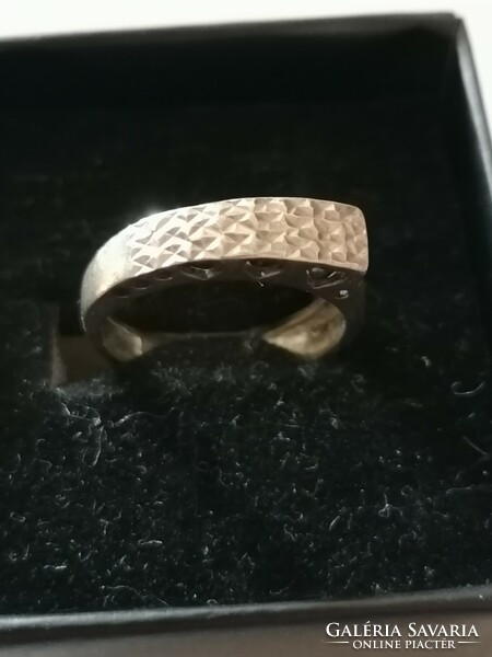 Silver women's ring with an openwork pattern