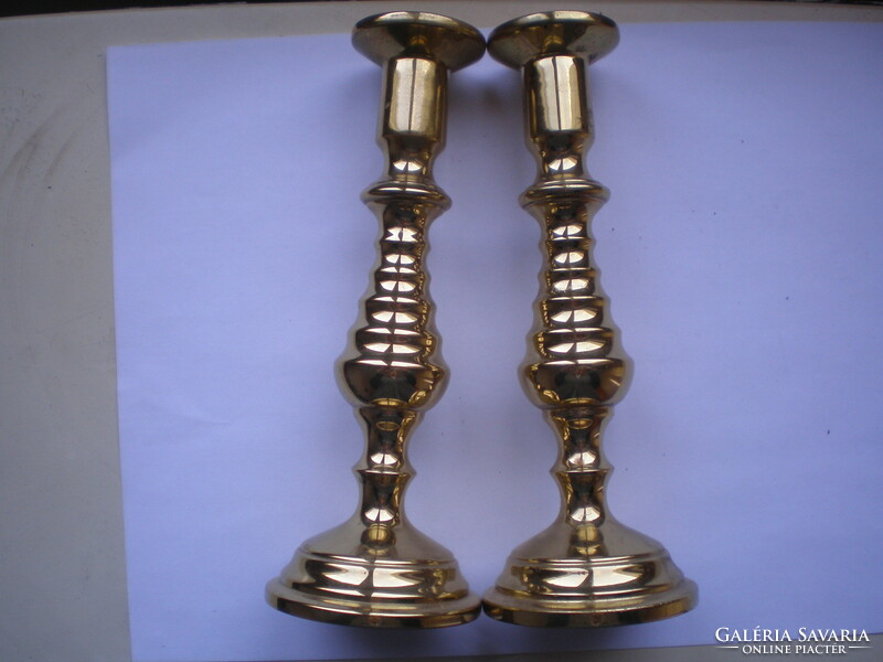 Brass cast candle holders in new condition, 17.5 cm high, base diam. 6.5 cm