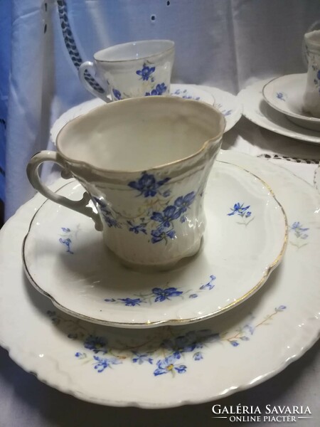 Old porcelain coffee set with breakfast plates