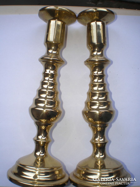 Brass cast candle holders in new condition, 17.5 cm high, base diam. 6.5 cm