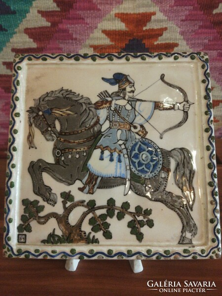 Hun warrior on the back of a horse. Ceramic mural.