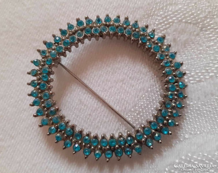 Silver colored, blue stone brooch, pin