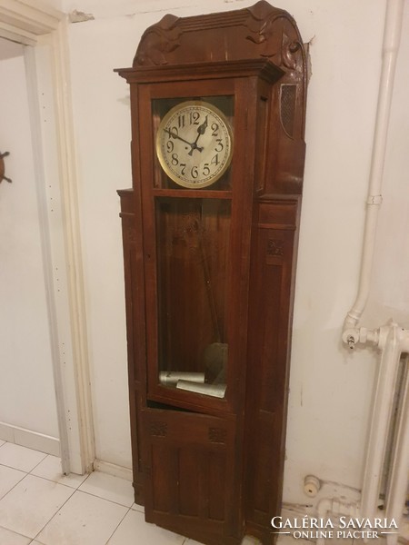 Antique carved two-weight standing clock