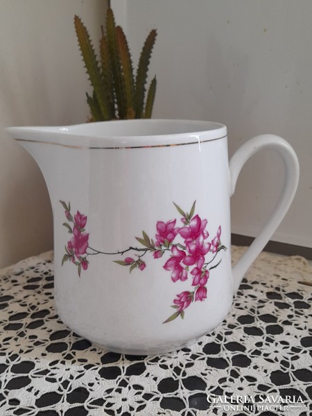 Solid jug with floral pattern
