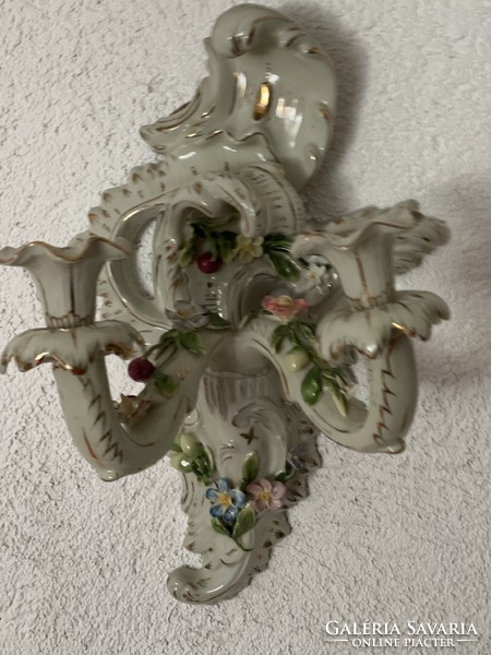 Beautiful antique large two-armed porcelain candle holder with applied flowers