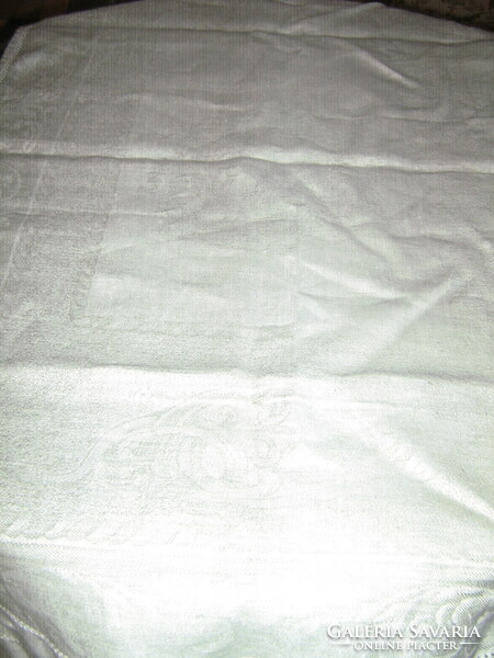 Beautiful pastel woven damask tablecloth runner with acanthus leaf pattern
