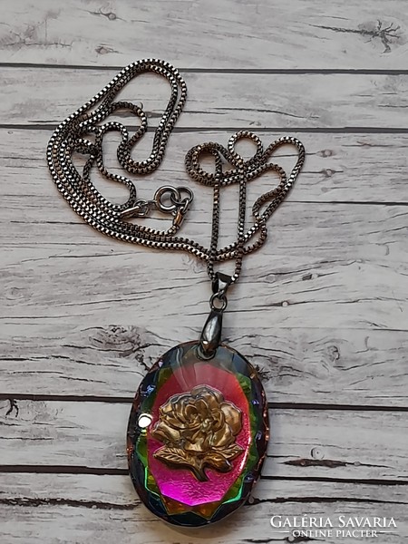 Pink glass pendant on a long metal chain
