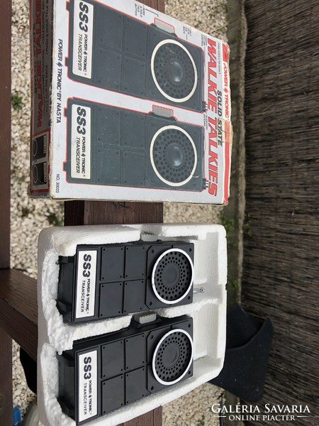 Retro power tronic walkie-talkies in their forest box