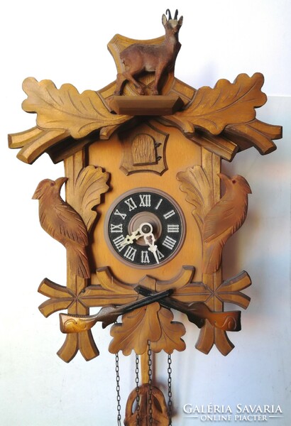 Carved black forest cuckoo clock with chamois