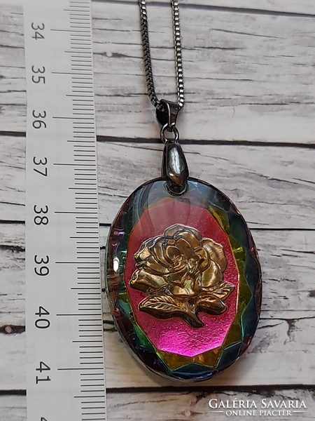 Pink glass pendant on a long metal chain