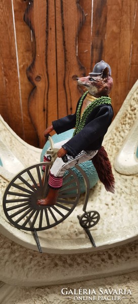 Fox fantasy figure sitting on a velocipede - decor 30 cm