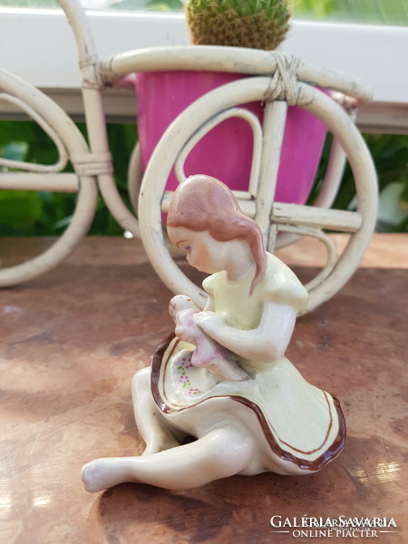 Porcelain baby girl figurine
