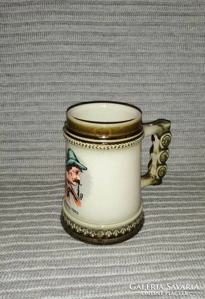 German ceramic beer mug with image of a man smoking a pipe, plisting 1983 (a12)