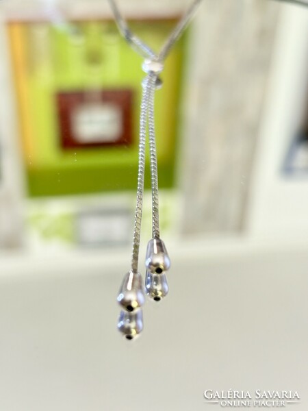 Fabulous silver necklace-necklace, embellished with pendants.