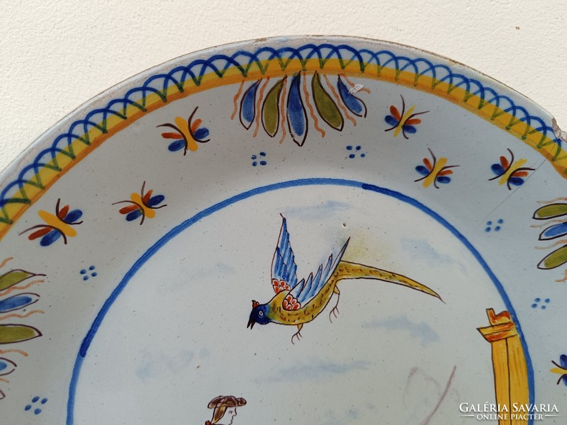 Antique Delft porcelain plate with painted cannon military cardboard motif hairline crack 19th century 8643