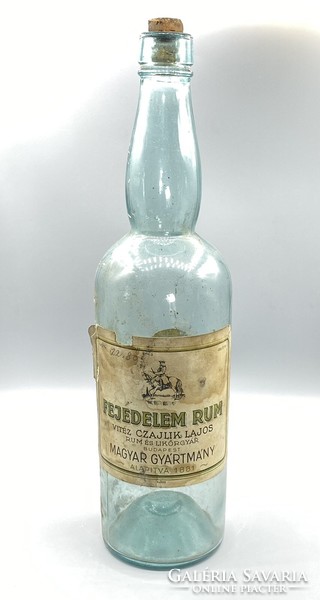 A bottle of Feudelem rum vítez cájlik with Lajos Redeti label