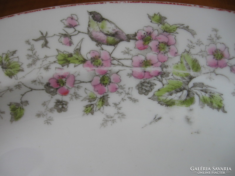 An antique meat dish with birds is on the way