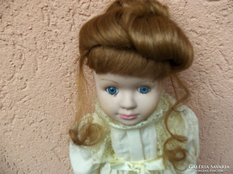 Porcelain doll with a bun