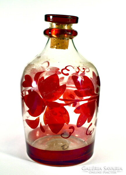Antique crimson stained glass bottle with cork