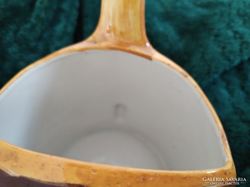 Handmade, ceramic watering can - in a rural atmosphere