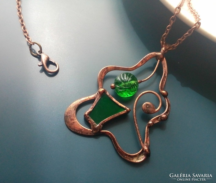 Green glass jewelry pendant with dark green glass and pearls