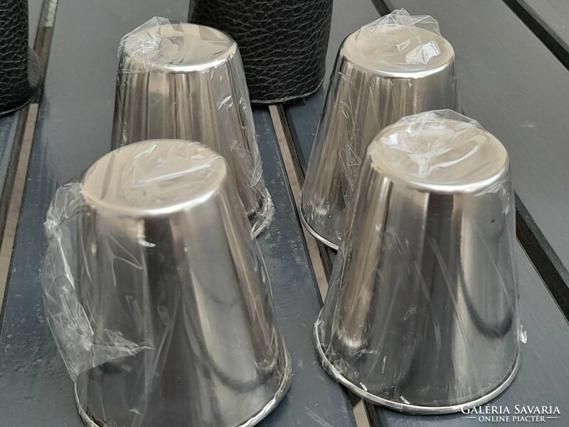 Metal tumblers in storage holder