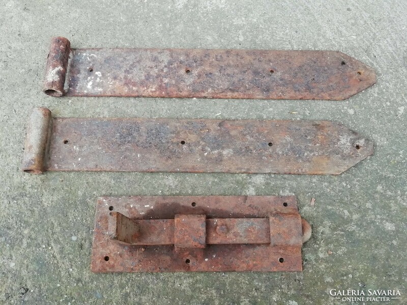 Old iron door, gate hinges, sliding lock