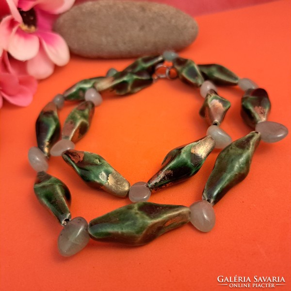 Old jade and porcelain beads.