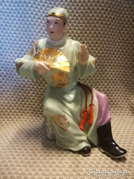 Oriental stoneware male figure with fan