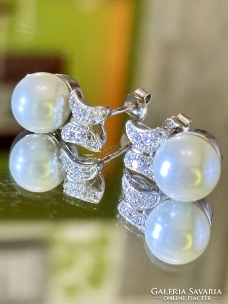 A beautiful pair of silver earrings with pearl and zirconia inlay