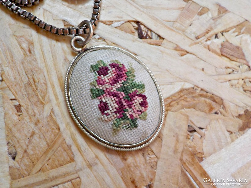 Old tapestry inlaid pendant on a silver-plated chain
