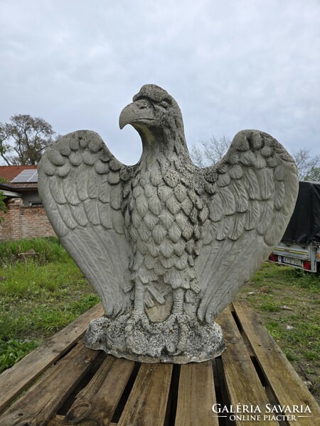 Old, old artificial stone eagle statue